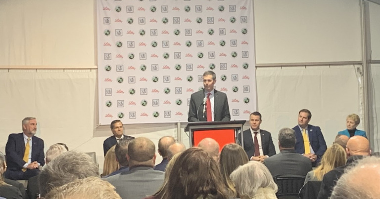 Eli Lilly CEO David Ricks (at podium) announces Lilly's latest plans in Boone County, joined from left by Indiana Gov. Eric Holcomb, Secretary of Commerce Brad Chambers, Sen. Todd Young, Lebanon Mayor Matt Gentry and Ivy Tech President Sue Ellspermann. (IIB Photo/Gerry Dick)
