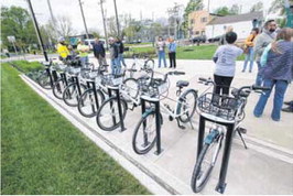 The Greenfield Parks Dept. held a ribbon cutting for the city’s new bike share program on Monday. Bikes will be available at three city parks — Brandywine, Riley and Depot Street — starting sometime next week. Tom Russo | Daily Reporter