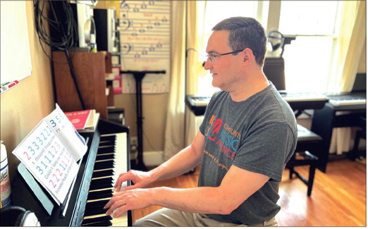 Owen Heritage, director of Community Music Alliance, also teaches keyboard lessons at the nonprofit’s New Albany music center. The organization is seeking additional funding to support its lessons program. Brooke McAfee | News and Tribune