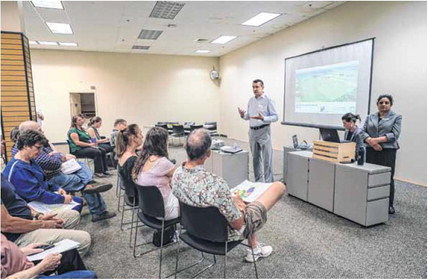 City of Columbus Planning Director Jeff Bergman welcomes members of the public to an open house for Columbus Regional Health’s and the city’s draft plan for development of the CRH property on the westside of Columbus at NexusPark on Thursday.  Staff photo by Mike Wolanin