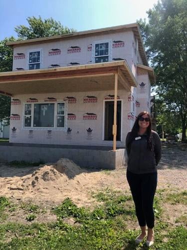 Erika Kendall and her family, who currently live in the county, are in the market for a brand new, two-story home, and the single-family structure being built by Bricks & Gables, Inc. caught her eye. Staff photo by Sue Loughlin