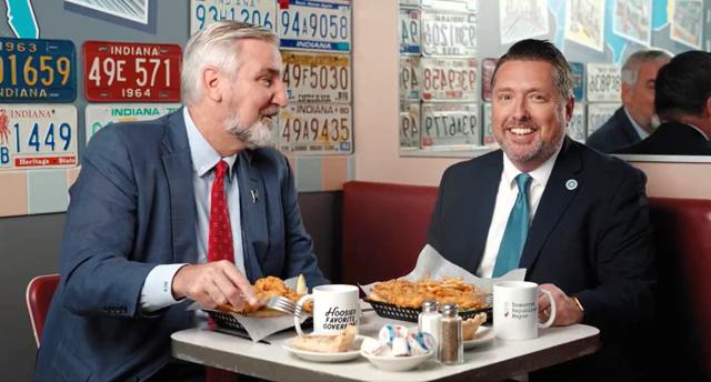 Indiana Gov. Eric Holcomb, a Republican, (left) and Sullivan Mayor Clint Lamb, a Democrat, (right) participated in a message for Disagree Better, an initiative by the National Governors Association. The message was filmed at the Oasis diner in Plainfield. Courtesy National Governors Association