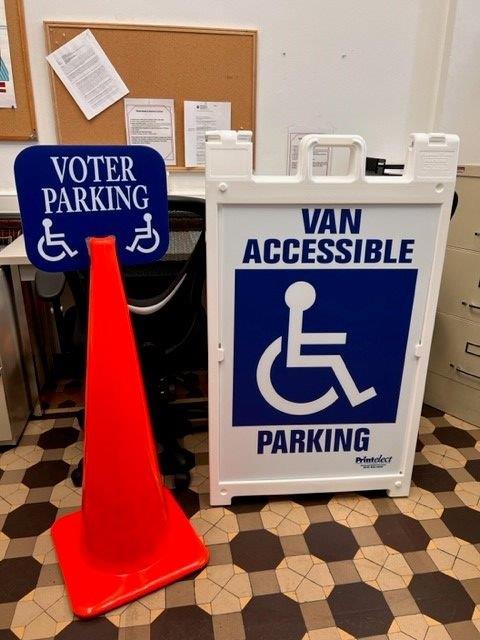 The Clinton County Clerk's office purchased orange cones and van accessible signs to post at polling sites to improve access for disabled voters. (Photo/Stephanie Harshbarger)