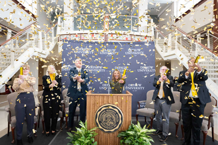 As confetti showers down around them, DePauw University leaders celebrate the announcement Wednesday of a $200 million gift to the Bold and Gold 2027 strategic plan. Speakers who shared insight into the impact of the gift — the largest in school history — include (from left) DePauw Student Government President Paige Burgess, College of Liberal Arts and Sciences Dean Bridget Gurley, Board Chair Doug Smith, President Lori White, Vice President Dave Berque and Creative School Dean Marus Hayes. Courtesy photo/DEPAUW UNIVERSITY