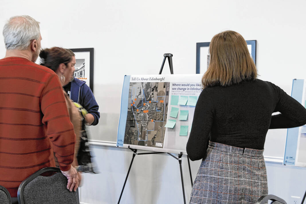 Residents look at a board with information about Edinburgh land use at the comprehensive plan open house held Wednesday at the town hall. Jayden Kennett | Daily Journal
