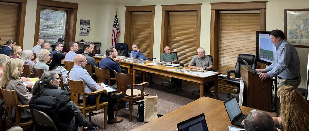Arevon Project Manager Paul Cozens addresses the Putnam County Commissioners and a full house Monday morning regarding the proposed Cold Spring Solar Farm in Russell Township. The commissioners moved to deny the rezone request by a 2-1 vote. Banner Graphic/JARED JERNAGAN