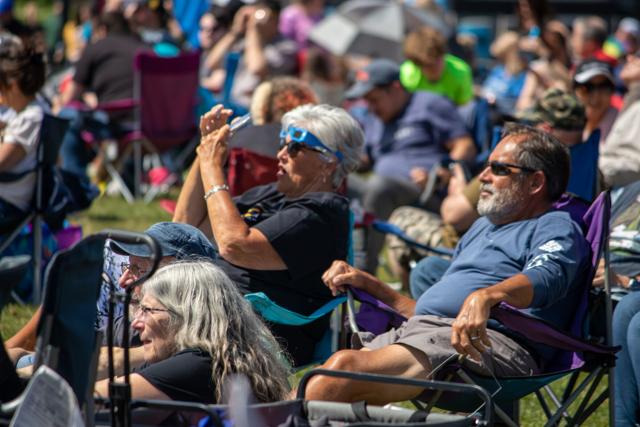 People inside the Amphitheater Venue in downtown Franklin take photos of the eclipse Monday. The much-feared clouds stayed away, and the temperature around the time of the eclipse was 76 degrees. Photo by Hannah Johnson, TheStatehouseFile.com.