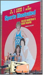 Muralist Becky Hochhalter works on the Sports Illustrated Larry Bird cover mural from 1977 on the side of the Copper Bar on Thursday on Wabash Avenue. Tribune-Star/ Joseph C. Garza