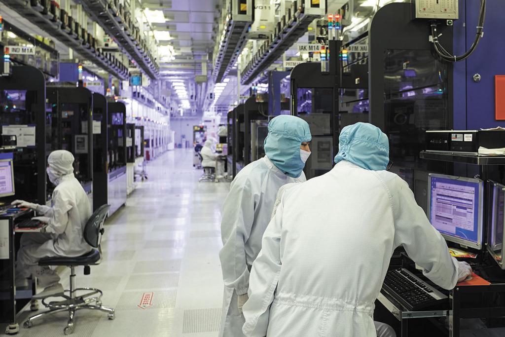 SK Hynix employees work in a clean room, which is monitored continuously to detect contaminants and to maintain proper temperature and humidity levels. The Korean company plans to build a $4 billion semiconductor plant in West Lafayette. (Photo courtesy of SK Hynix)