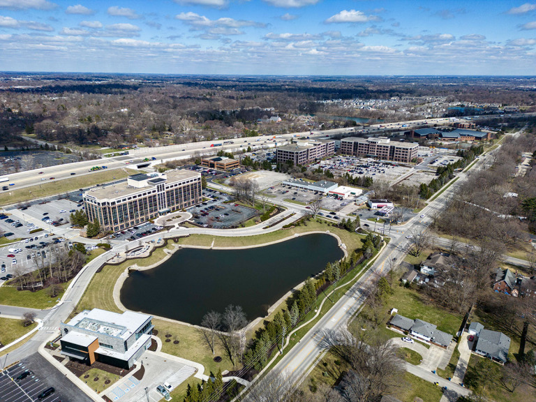 The office emphasis in Parkwood Crossing will be replaced by a focus on live/play walkability. Components are set to include housing, restaurants, entertainment and green space. (IBJ photo/Mickey Shuey)