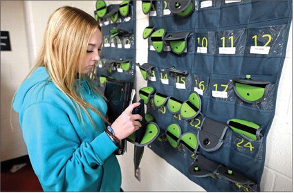 Booker T. Washington High School senior Caleigh Thompson removes her phone from a Yonder pouch on Oct. 8 at the school in Terre Haute. 
Tribune-Star | Joseph C. Garza