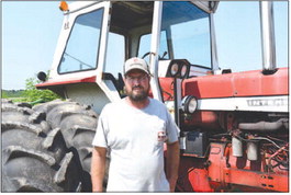 New Washington farmer Tony Webb with the first tractor he ever got. It has been with him through his whole farming journey and he still uses it to this day. Erik Hackman | News and Tribune