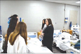 Amanda Gulley goes over patient care with her students who are in the Certified Nursing Assistant program at Prosser. News and Tribune file