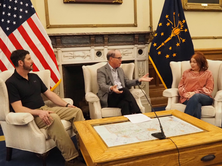 From left: Franklin homeowner Mark Gross, Indiana Gov. Mike Braun and Indianapolis homeowner Jennie Reith talk property taxes in the governor’s office on Tuesday, Feb. 4, 2025. (Leslie Bonilla Muñiz/Indiana Capital Chronicle)