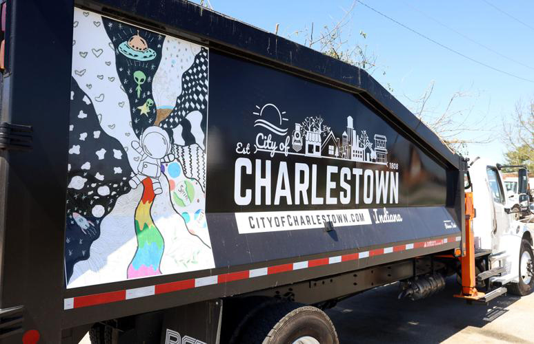 Brianna Deidra's artwork is the side of one of the Charlestown garbage trucks. She drew and astronaut is the middle of several designs she created. City ofCharlestown image