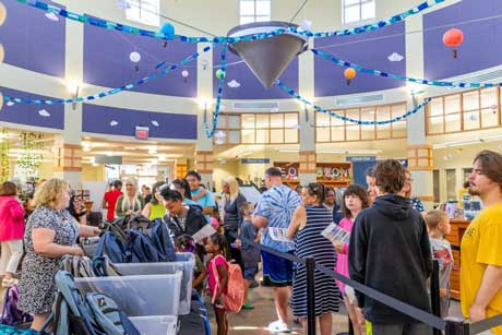 Families collect food from the Summer Feeding Program at Allen County Public Library’s Georgetown branch in 2024. Twice as much food will be distributed this summer. 
Courtesy Allen County Public Library