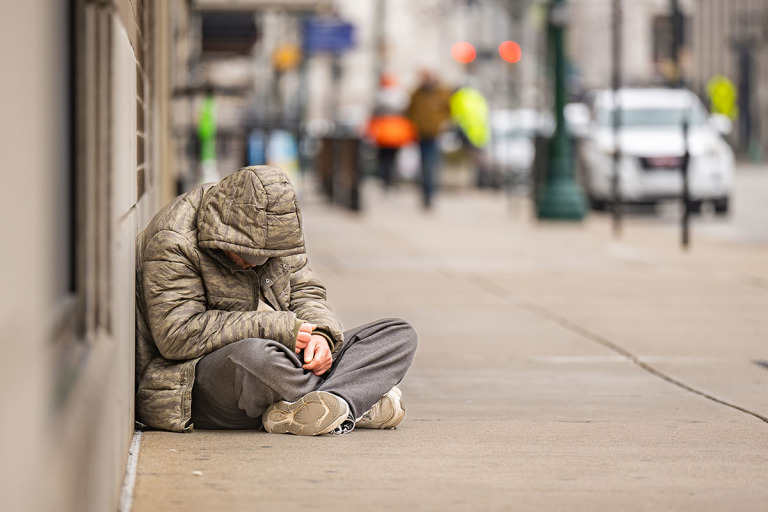 In the city’s central business district, where fewer workers mean less vibrancy, problems like homelessness and infrastructure problems persist. (IBJ photo/Chad Williams)