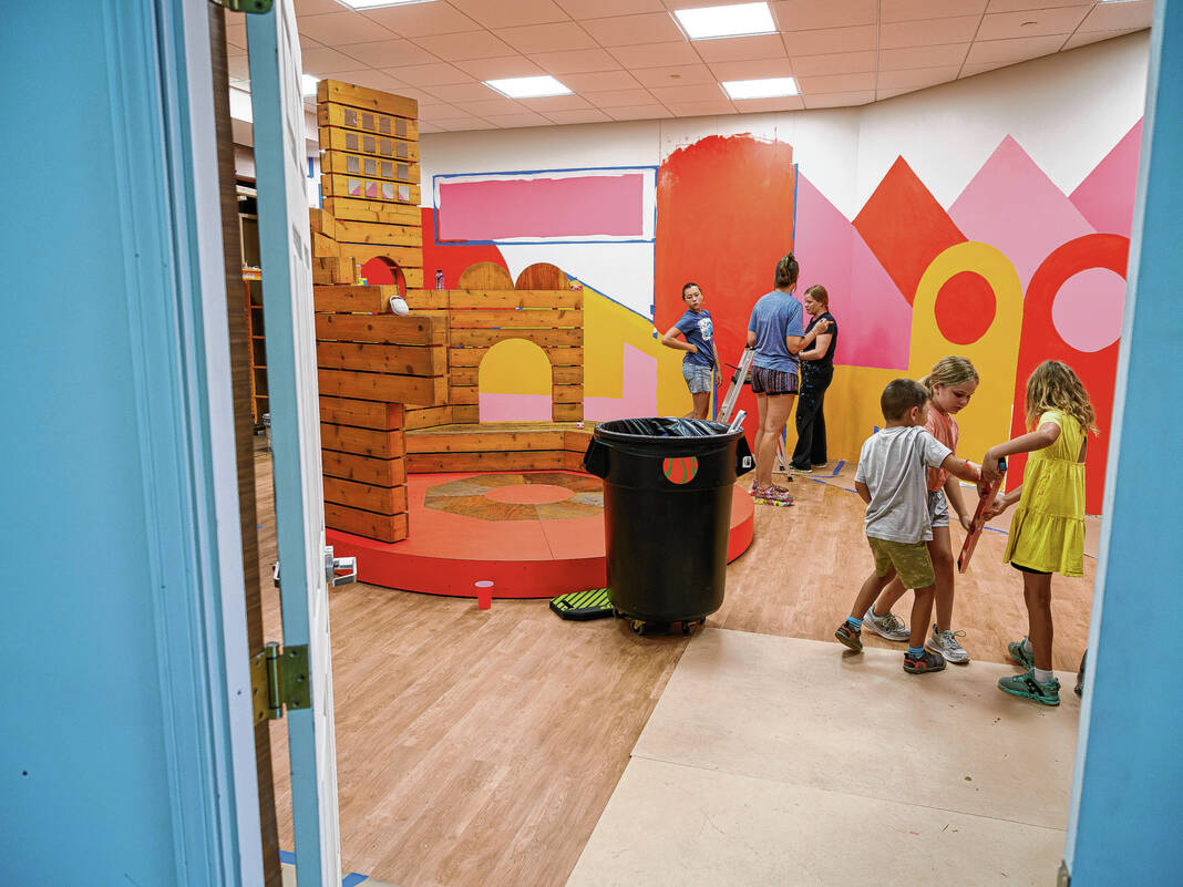 Mike Wolanin | The Republic Volunteers help prep the area where the former Exhibit Columbus installation Carousel will be located at NexusPark in Columbus, Ind., Monday, June 30, 2025.