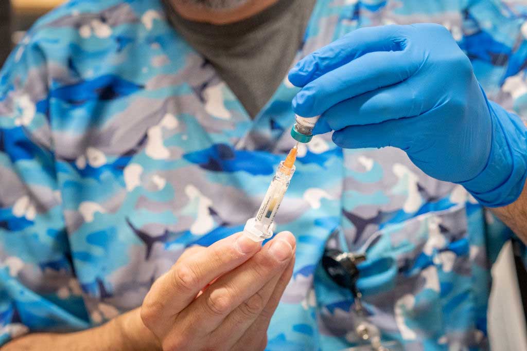 A worker fills a syringe with measles vaccine in Lubbock, Texas, in March, 2025. Measles cases have reached a 33-year high, affecting 39 states, as vaccine skepticism gains a foothold in the Trump administration.(Photo by Jan Sonnenmair/Getty Images)