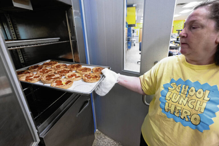 Melissa Colson helps with lunch meals prepped at Greenfield-Central High School cafeteria on June 27, 2025. Tom Russo | Daily Reporter
