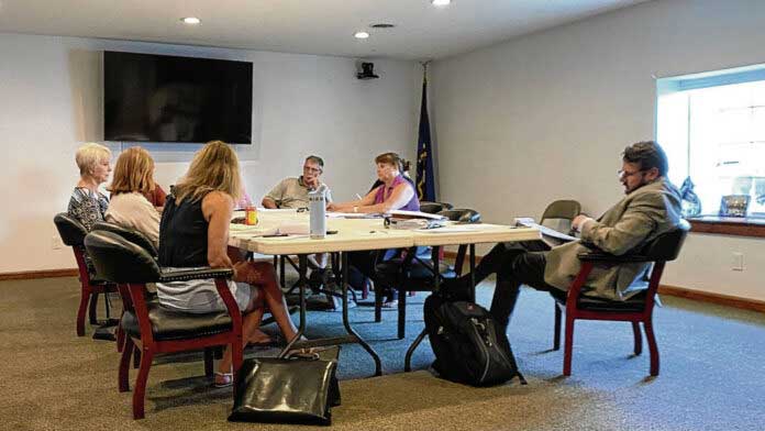 Board members for Nineveh and Hensley townships discuss budget information at a joint meeting July 30. Elissa Maudlin | Daily Journal