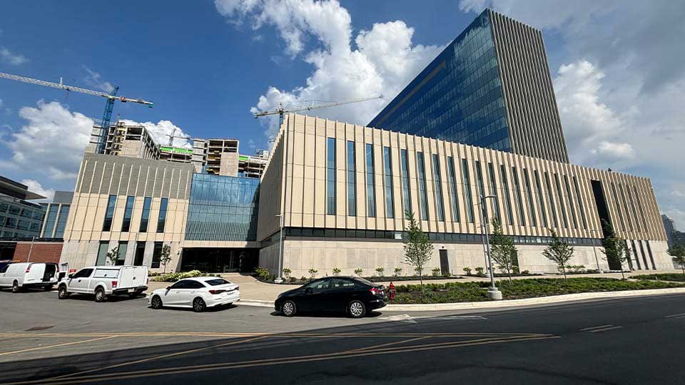 An exterior shot of the IU School of Medicine’s new medical education and research building in Indianapolis, with construction on IU Health’s new downtown hospital complex continuing in the background. (IIB Photo/Michelle Kaufman)