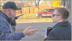 Logansport code enforcement officer Randy Ulery (left) speaks with Logansport Mayor Chris Martin in this file photo. Submitted photo 