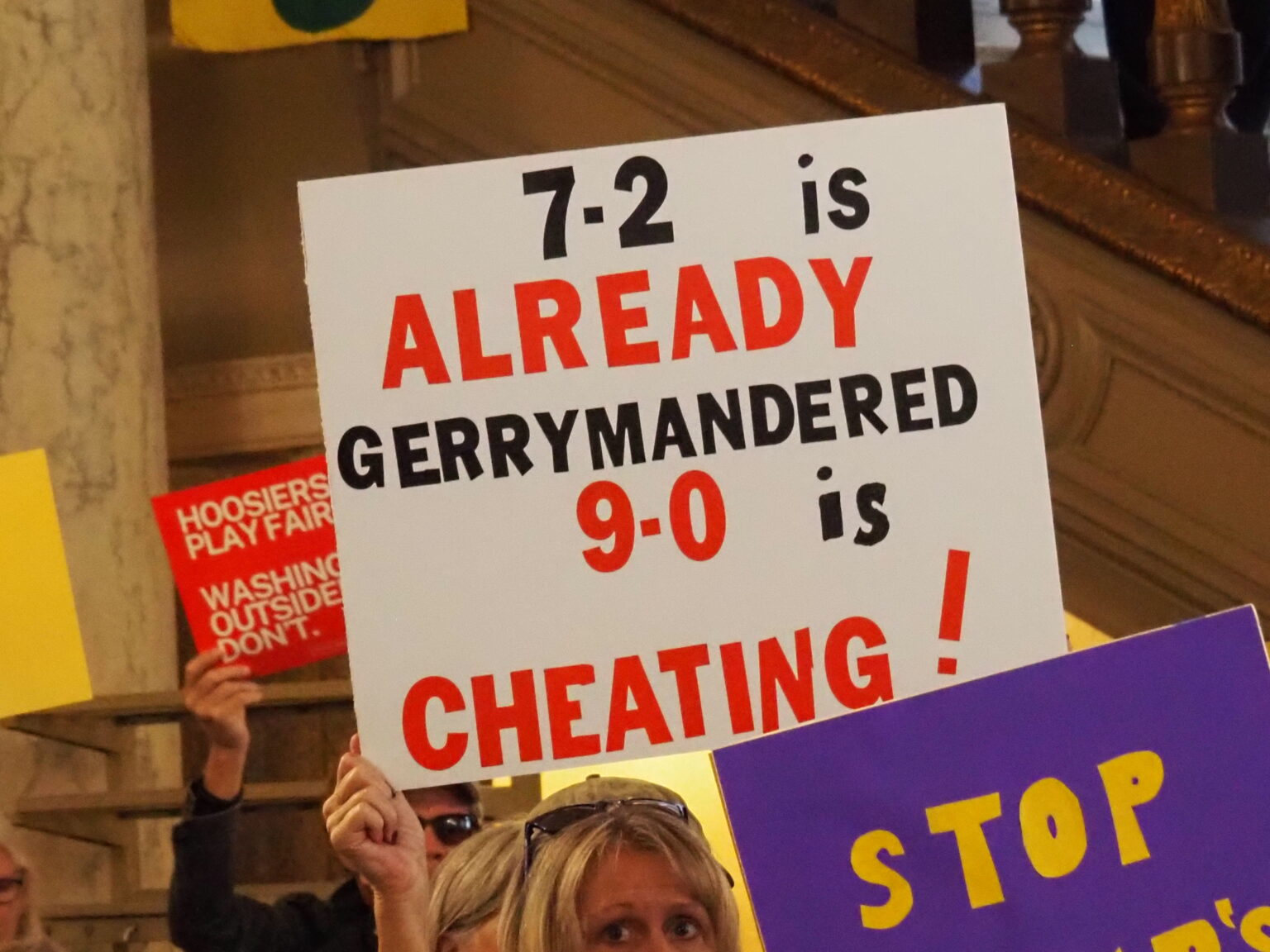 Hoosiers protest mid-cycle redistricting as cheating while at the Indiana Statehouse on Friday, Oct. 10, 2025. Many hold that Indiana’s current 7-2 split in the U.S. House already constitutes gerrymandering. (Photo by Leslie Bonilla Muñiz/Indiana Capital Chronicle)
