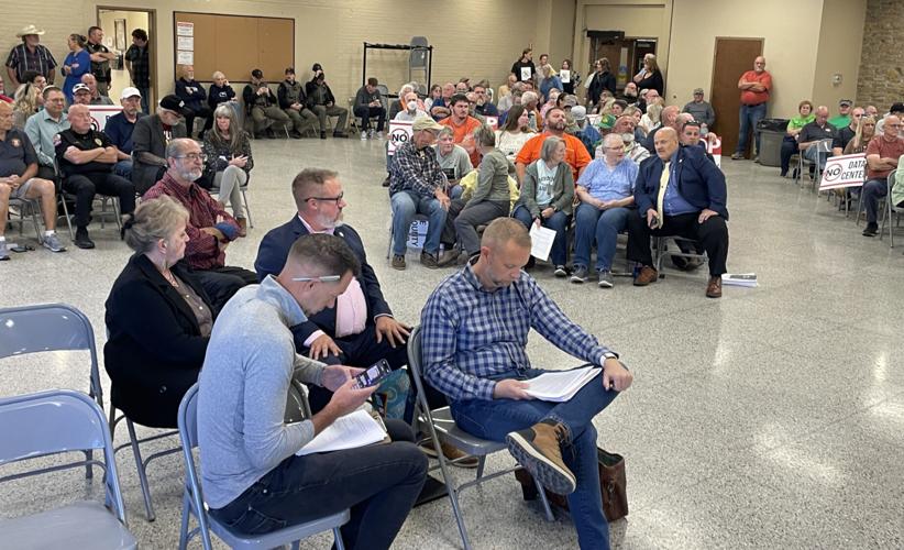 Henry County Technology Park developers Chris King (left foreground) and Greg Martz (right foreground) prepare for the Oct. 16 county planning commission meeting. Staff photo by Travis Welk