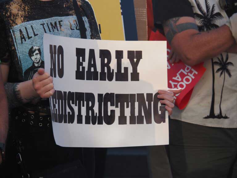 Hoosiers protest mid-cycle redistricting outside the Indiana Statehouse on Tuesday, August 26, 2025. (Leslie Bonilla Muñiz/Indiana Capital Chronicle)