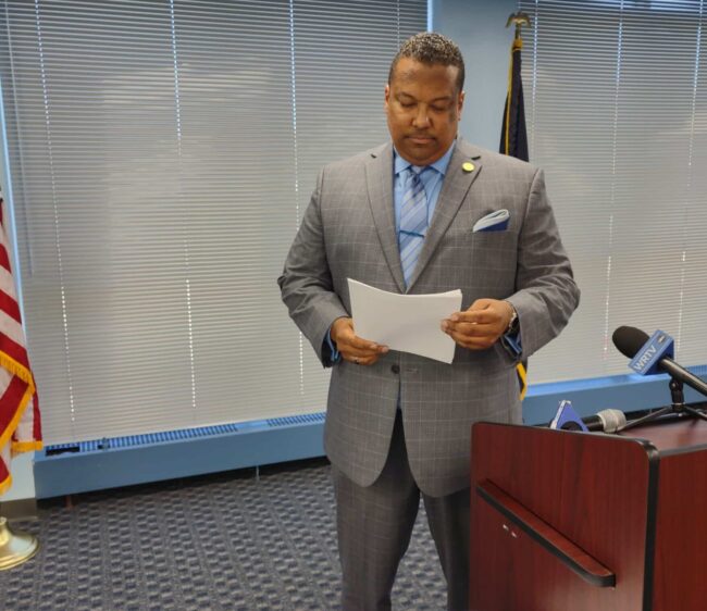 Indiana Rep. Earl Harris Jr., D-East Chicago, reviewed his remarks before the Indiana Black Legislative Caucus news conference against redistricting. (Photo/Marilyn Odendahl)