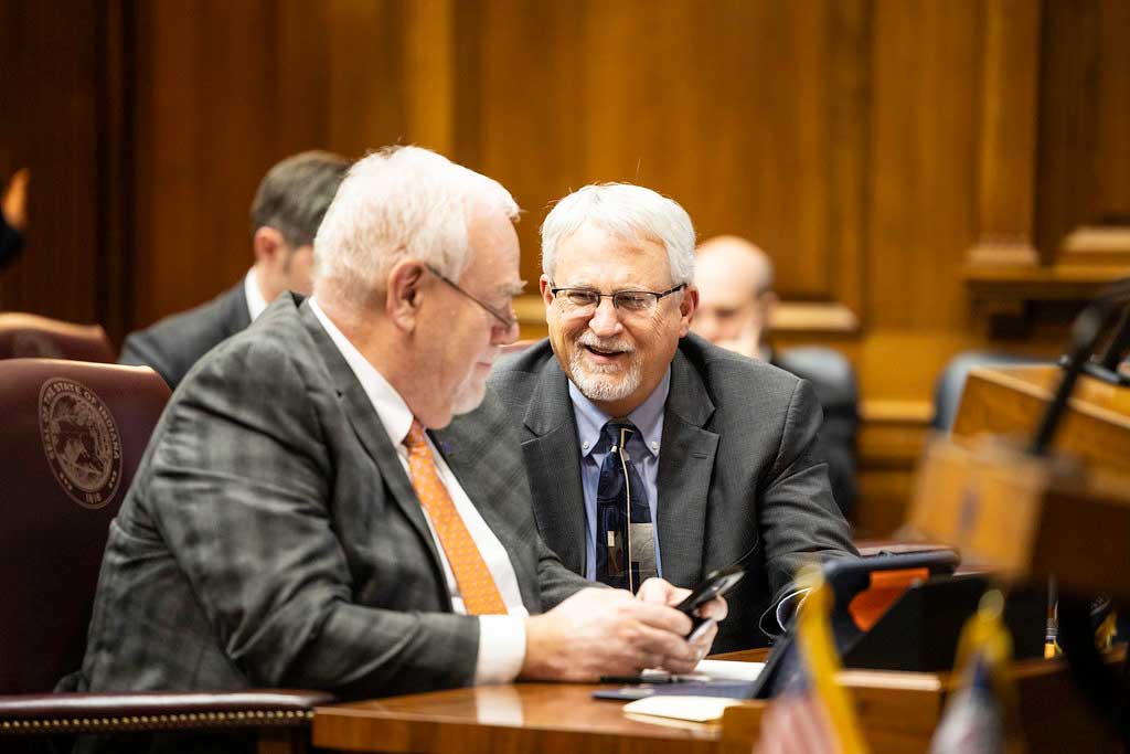  Indiana House Speaker Pro Tem Mike Karickhoff, right, speaks with House Majority Floor Leader Matt Lehman during the 2025 session. (Photo courtesy of House Republican Caucus)