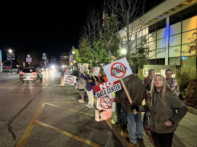 Hobart residents opposed to a pair of data center complexes planned for 61st Avenue gathered outside city hall before a Nov. 5 city council meeting.    Alex Dalton, The Times 

