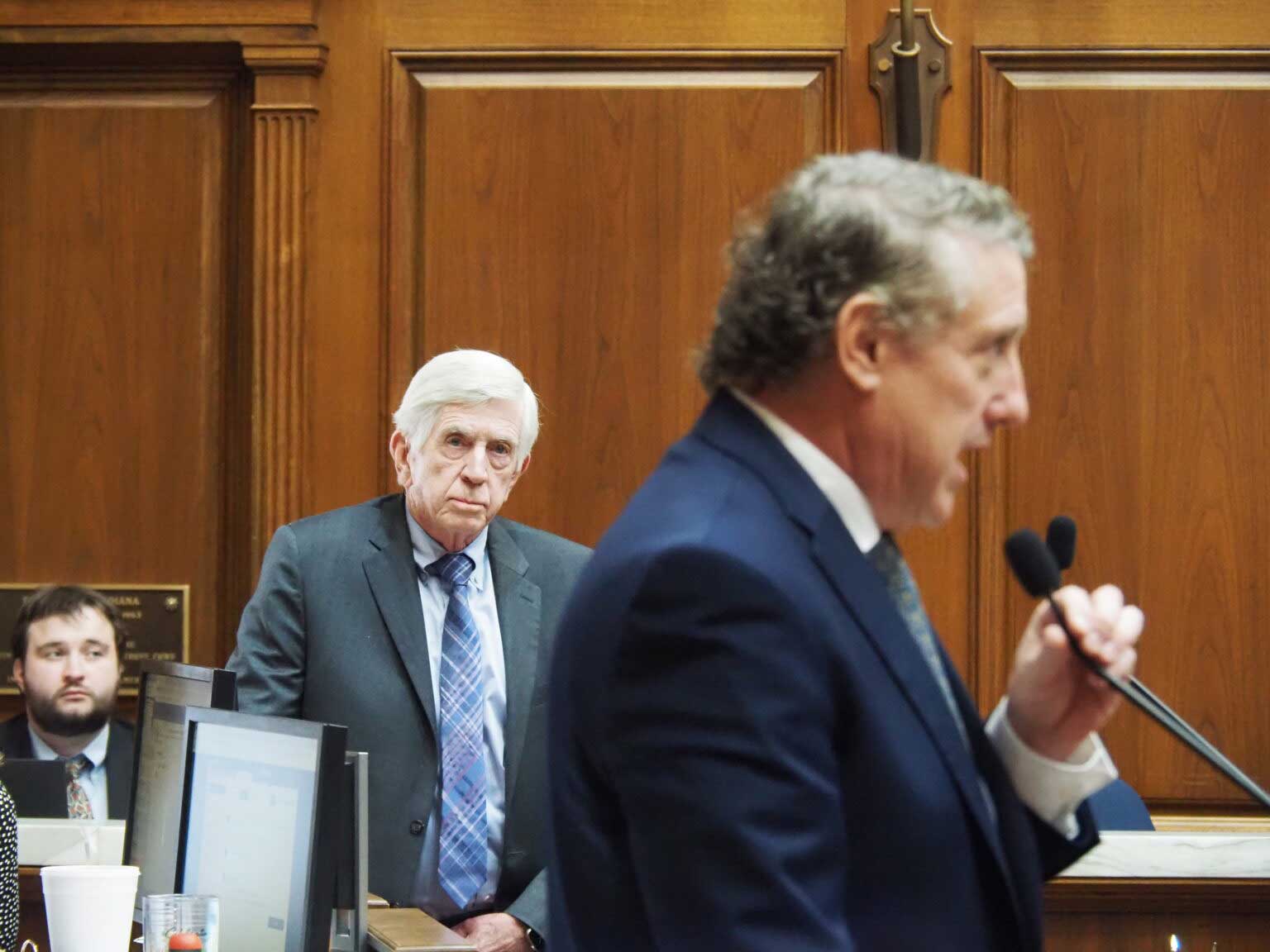 From left: Rep. Ed DeLaney, D-Indianapolis, listens as redistricting bill author Ben Smaltz, R-Auburn, urges the defeat of an amen