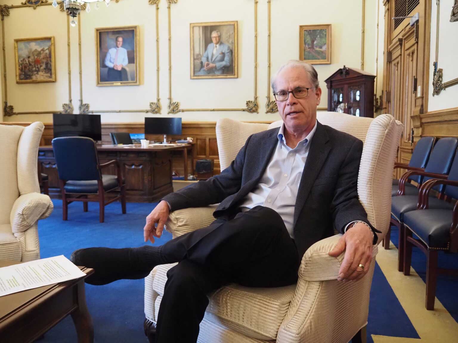  Indiana Gov. Mike Braun sits for an end-of-year interview with the Indiana Capital Chronicle in his Statehouse office on Tuesday, Dec. 16, 2025. (Photo by Leslie Bonilla Muñiz/Indiana Capital Chronicle)