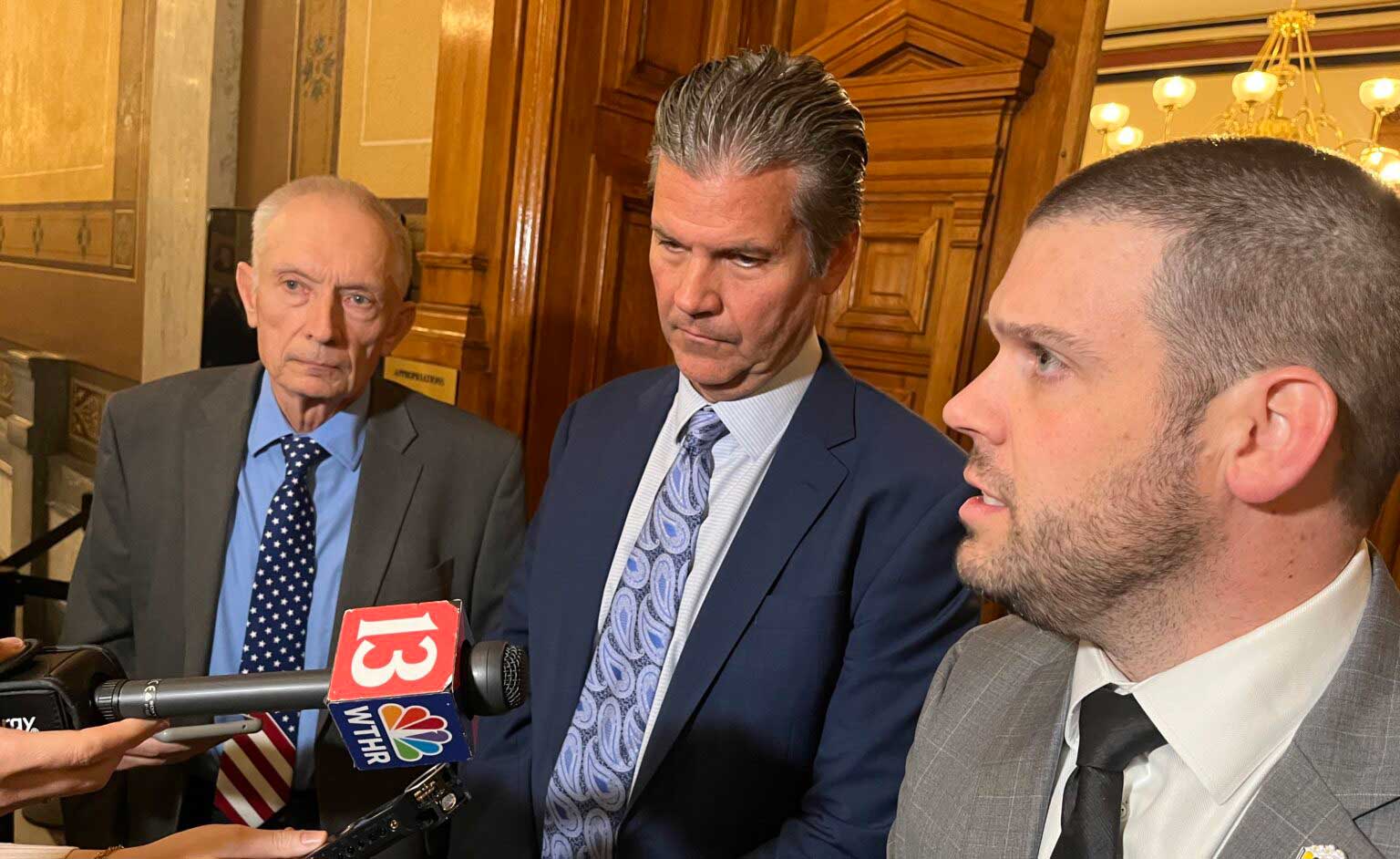 State Budget Director Chad Ranney, right, speaks with reporters alongside House Ways and Means Chair Jeff Thompsonn(R-Lizton), left, and Senate Appropriations Chair Ryan Mishler (R-Mishawaka) on Thursday, Dec. 18, 2025. (Photo by Tom Davies/Indiana Capital Chronicle)