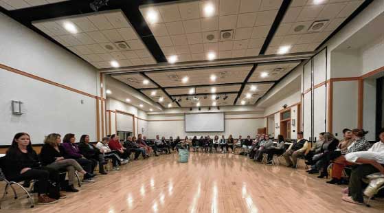 Participants gather to discuss what they experienced and learned during a poverty simulation held at Franklin College in 2024. The event is intended to simulate what a month in poverty can be like, and the challenges that people in poverty face. Another poverty simulation is planned at Franklin College on Jan. 14. SUBMITTED PHOTO
