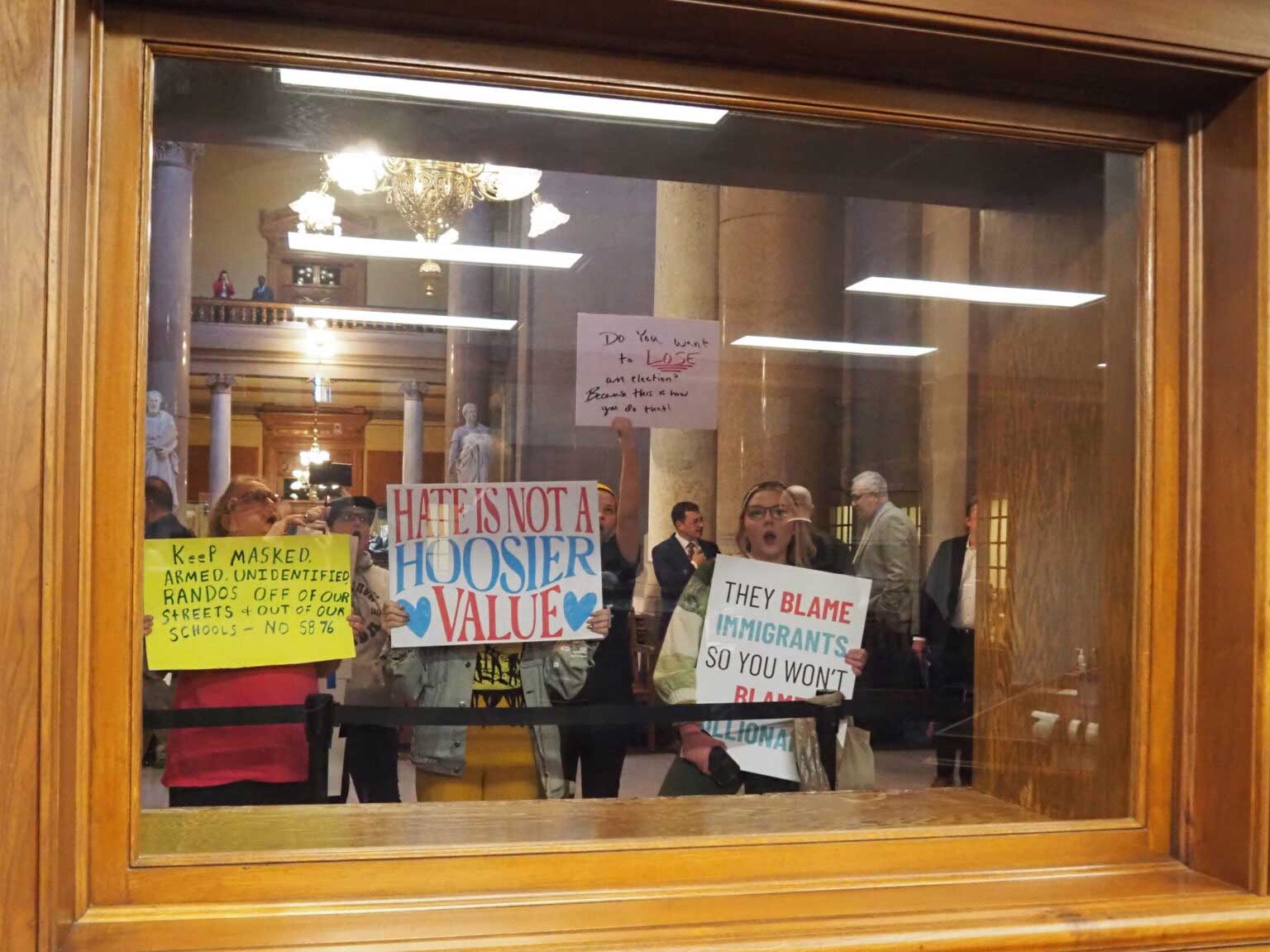 Hoosiers protest an immigration bill up for a concurrence vote outside the Senate chamber on Wednesday, Feb. 25, 2026. (Photo by Leslie Bonilla Muñiz/Indiana Capital Chronicle)
