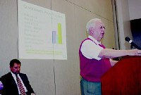 Morgan County Council member Bob O'Neal, who also serves on the Morgan Hospital and Medical Center community and business advisory council, spoke in favor of a moratorium on new health care facility construction Monday night at the Morgan County Commissioners' meeting. Morgan Hospital CEO Tom Laux is seated behind O'Neal. Photo by Keith Rhoades.