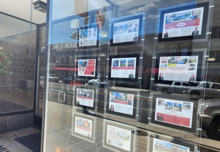 Property sale fliers sit posted in the window at Hosler Realty in downtown Kendallville on Friday. Assessed values in the four-county area jumped by more than 10% for 2023 in all four counties, with the increase driving primarily by rising sale prices for homes and land. Steve Garbacz